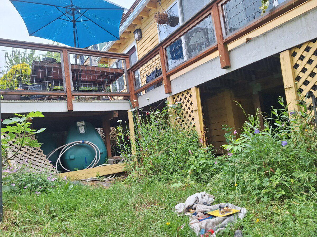 Connected rainwater tanks under deck