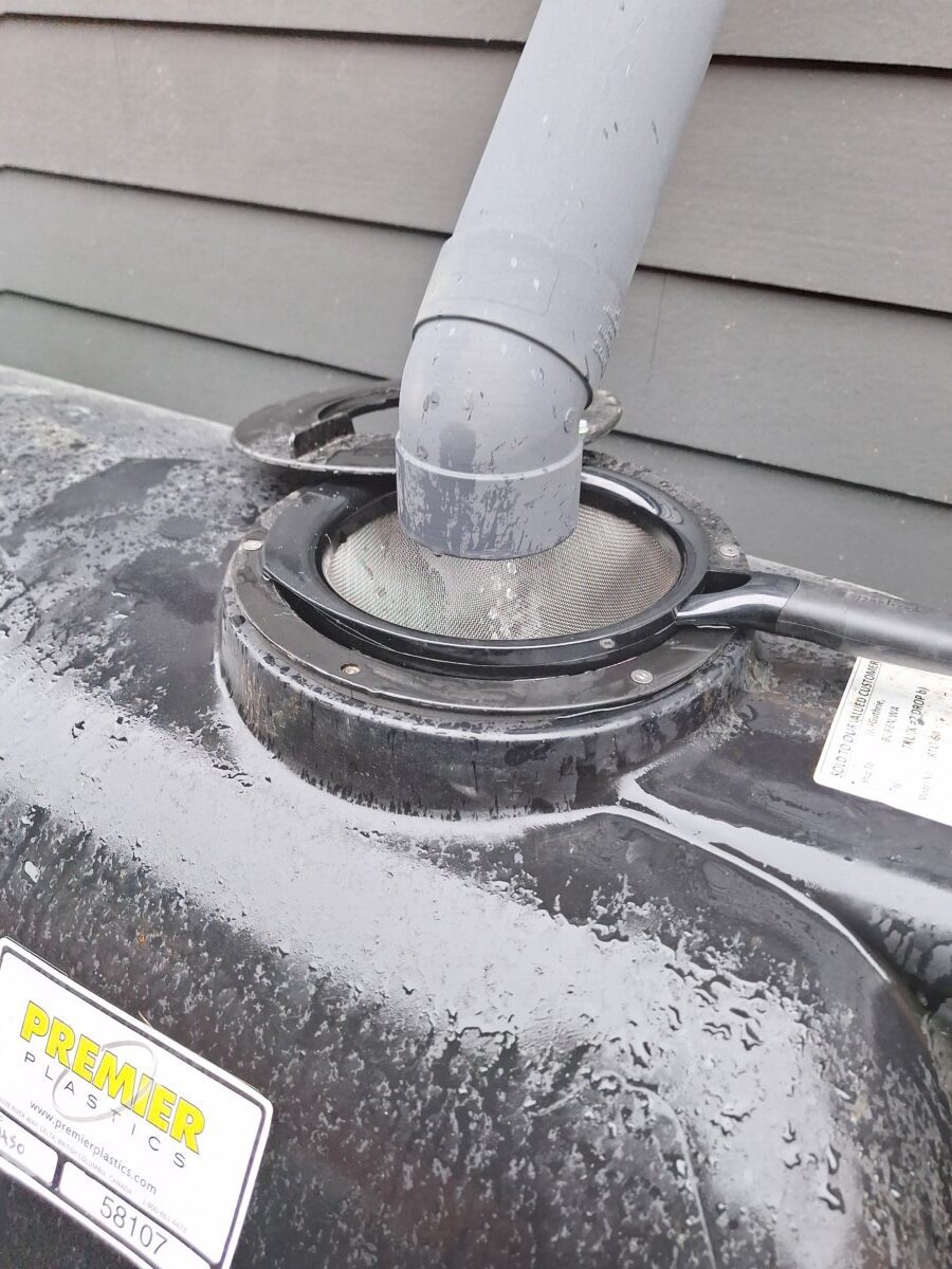 Dual rainwater storage tanks installed on a Seattle property